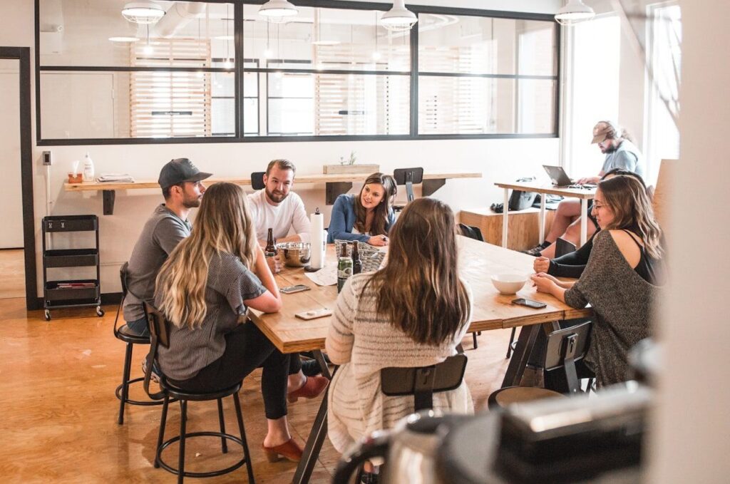 talking people sitting beside table